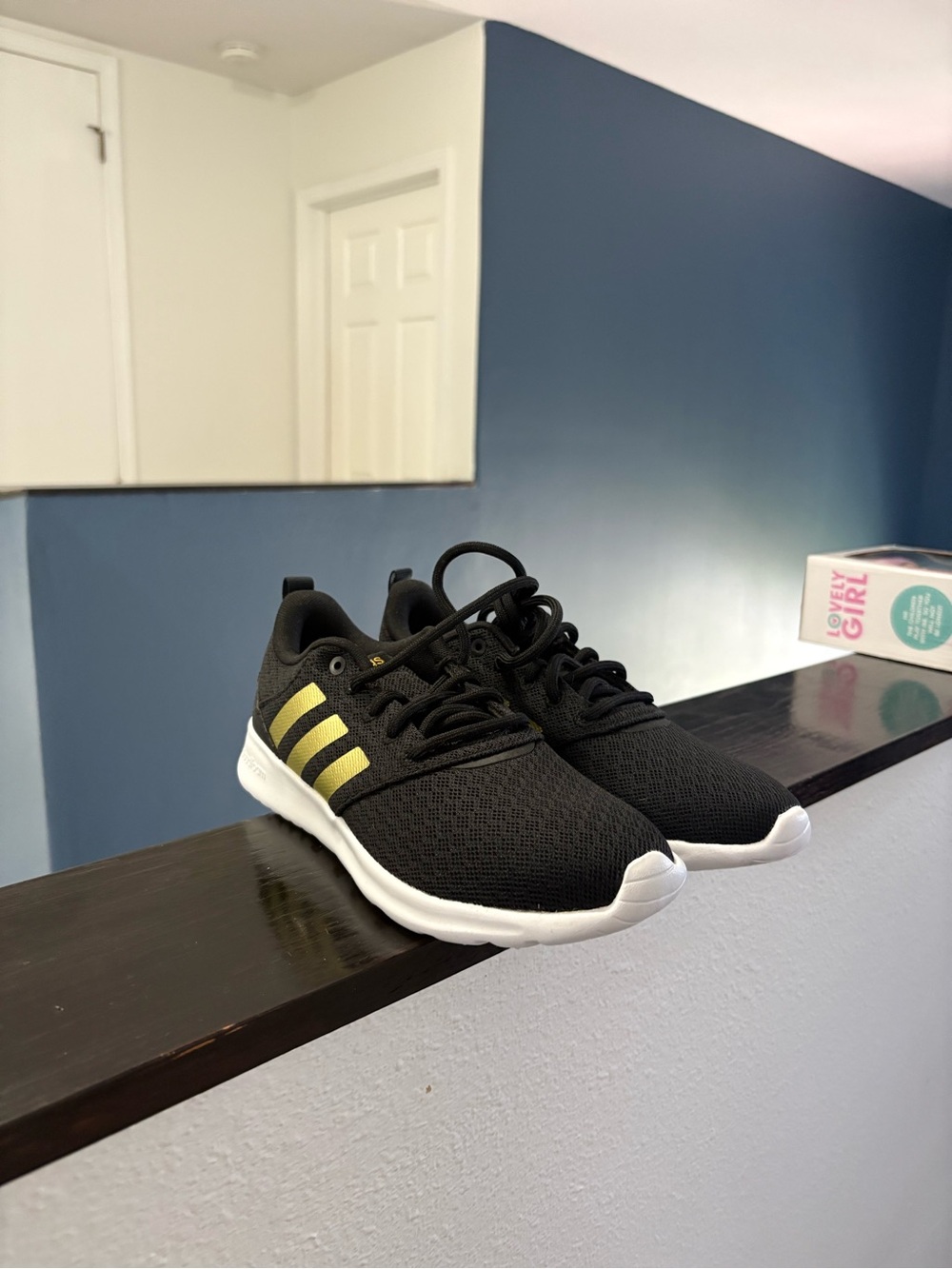 adidas Women’s Black Sneakers with Gold Stripes